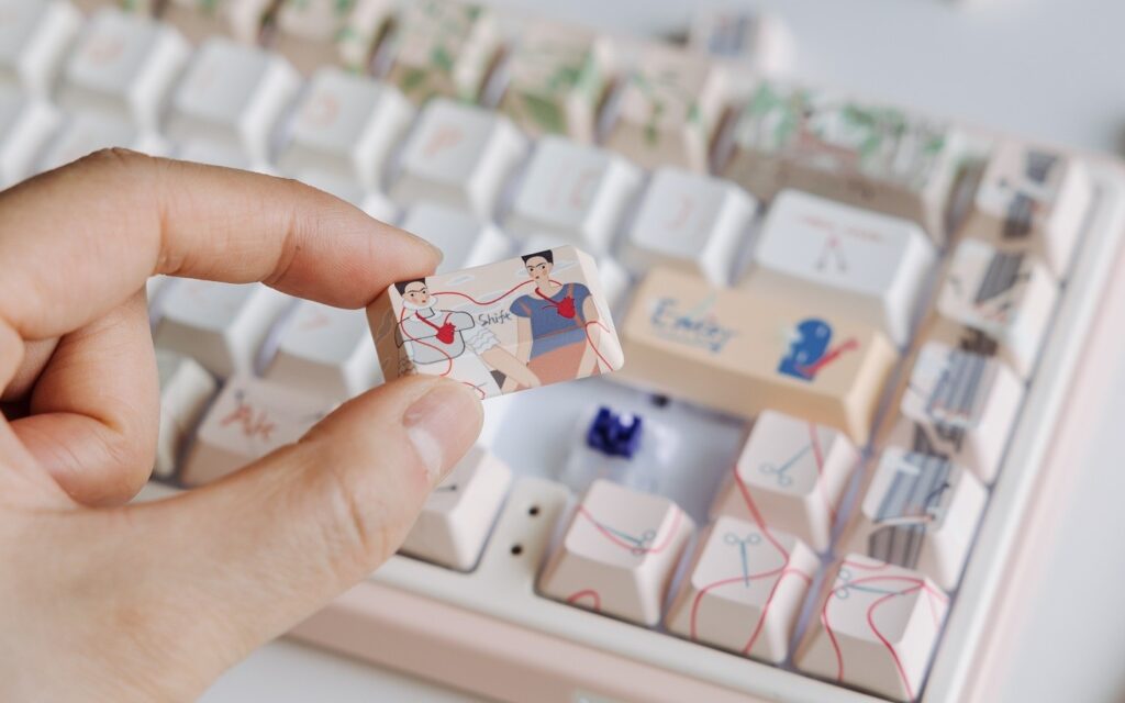 The shift key from Varmilo's Frida Kahlo keycap set showing a cute version of her work "The Two Fridas".